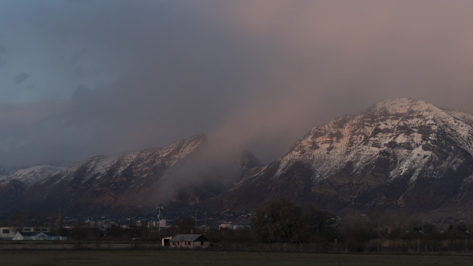 The canyon appears to exhale a kind of fog